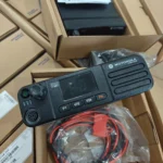 Motorola DM4400 DMR vehicle-mounted mobile radio unit held in hand