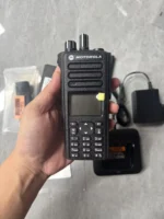 Motorola DP4800 DMR portable two-way radio held in hand