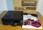 Yaesu FT-450D IPX6 water resistant VHF UHF dual band radio held in hand